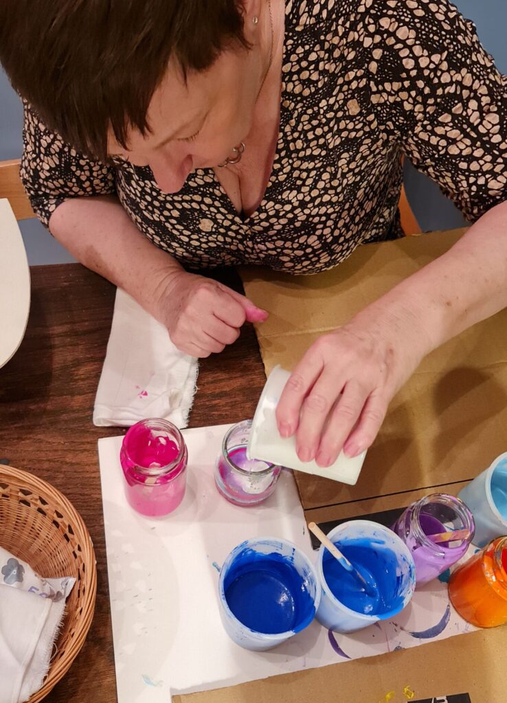 Mixing paint at a paint party in the Scottish Borders near Kelso